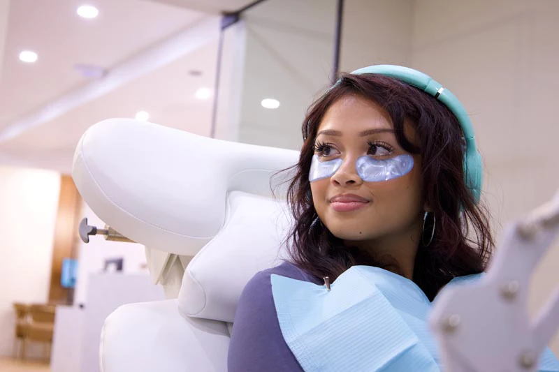 woman receiving dental care at Flossy Dentistry & Hygiene Clinic